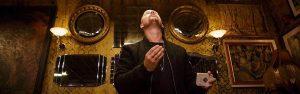 Award winning close up magician Parker looking upwards
