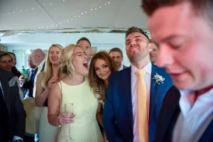Crowd at a wedding are entertained by top london magician Parker